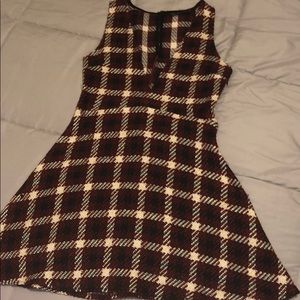 A burgundy, white, and black threaded dress.